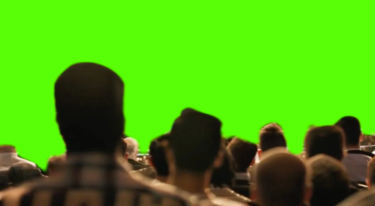 a group of people , raising hands in front of a green screen