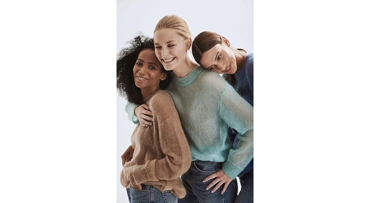 a group of women standing next to each other