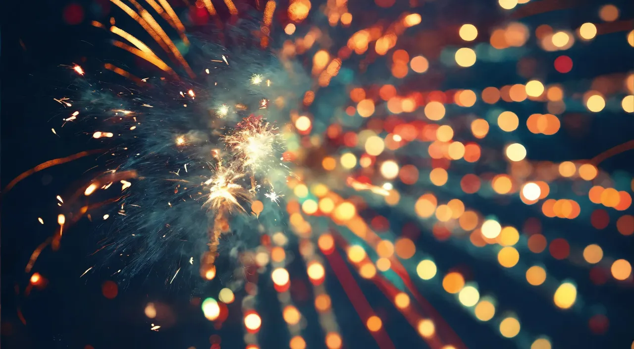 a colorful fireworks is lit up in the night sky