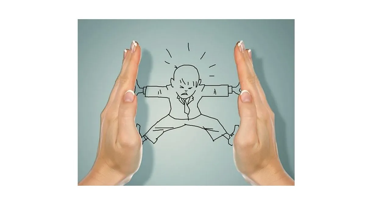 two hands holding a drawing of a person doing karate