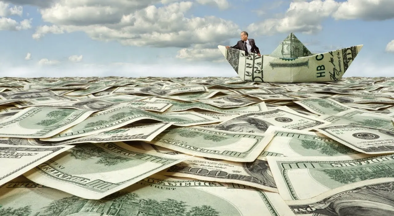 a man in a paper boat floating on top of a pile of money