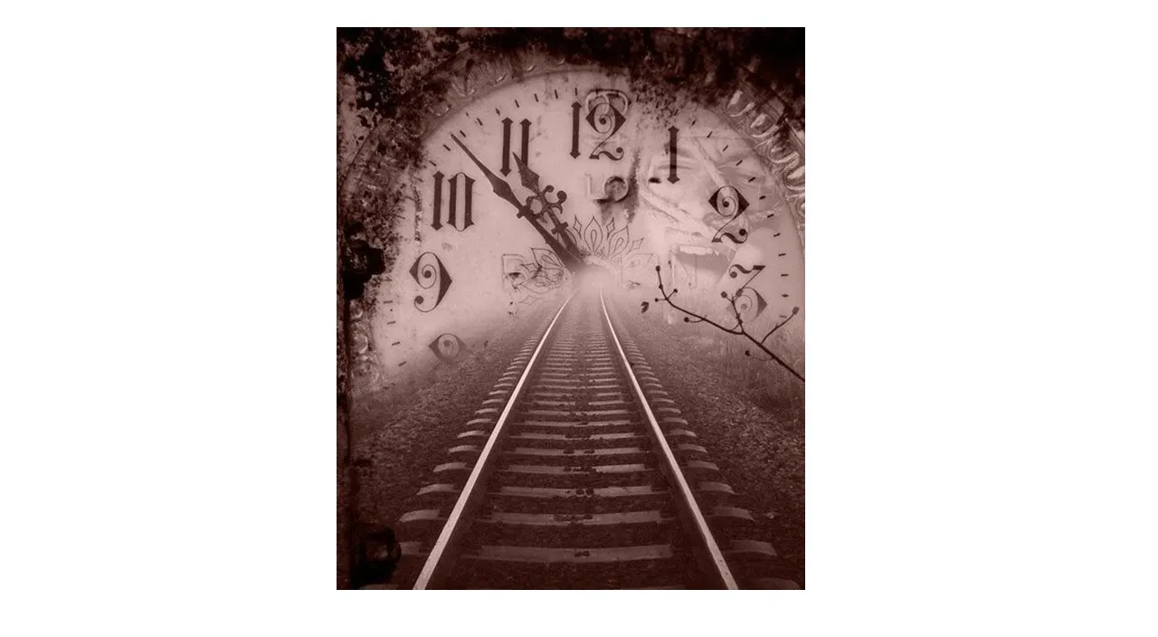 a black and white photo of a train track and a clock