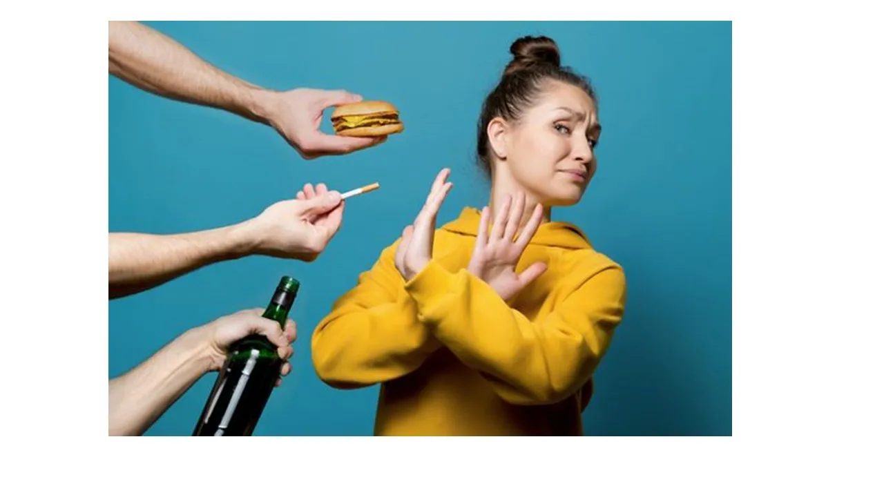 a woman standing in front of a group of people holding food