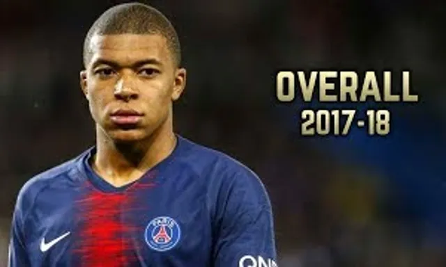 Kylian mbappe in a blue shirt with a red stripe