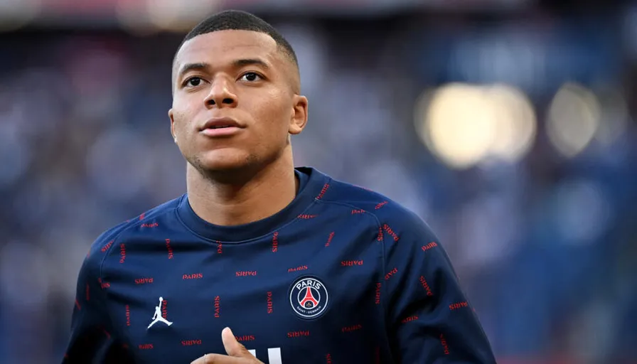 a close up of a mbappe giving a thumbs up