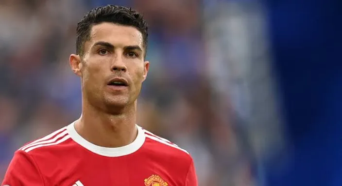 a man in a red and white soccer uniform