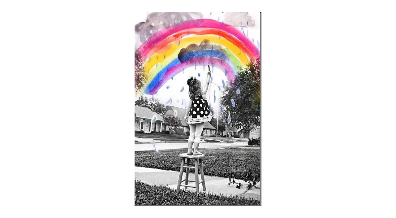 a person on a stool with a rainbow in the background