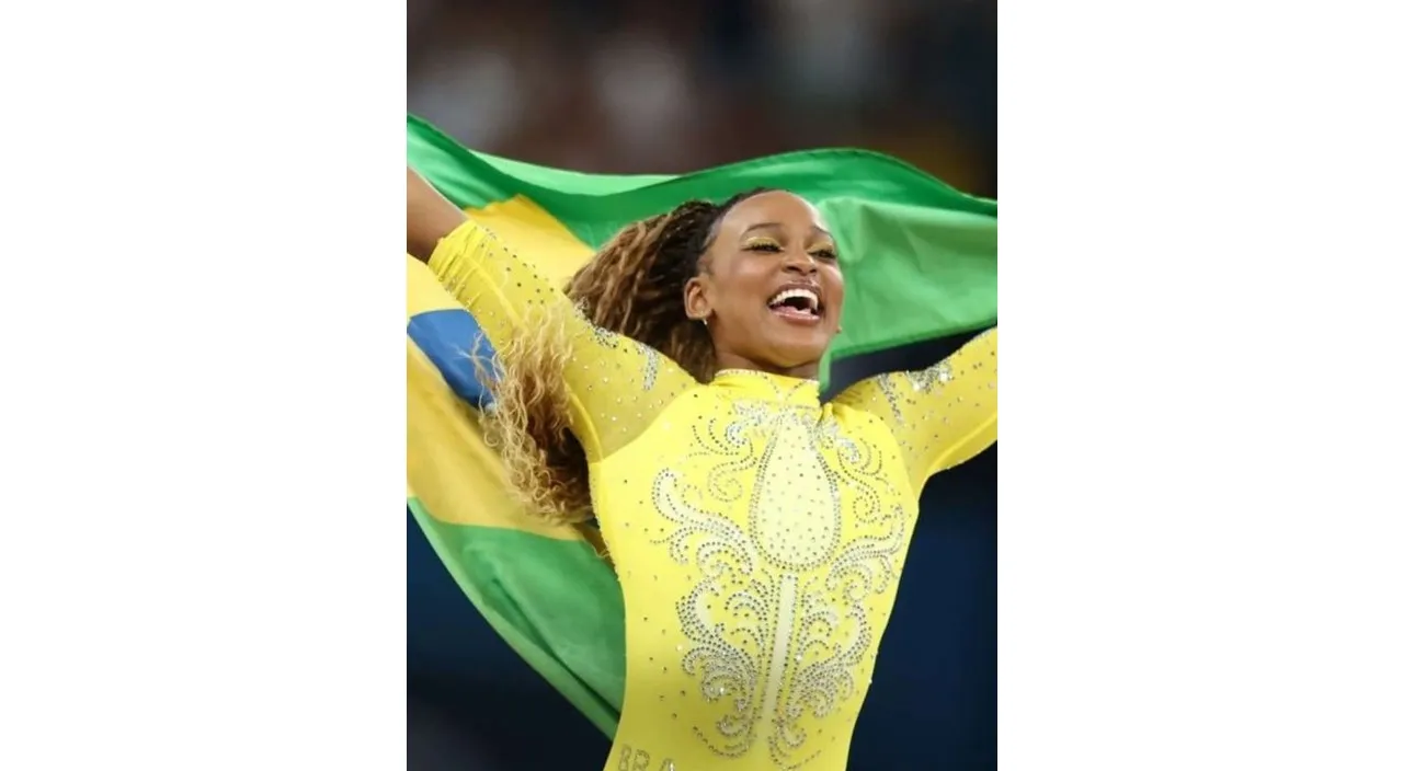 a woman in a yellow outfit holding a green and yellow flag