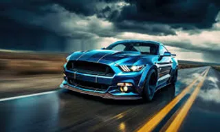 a blue car driving down a road under a cloudy sky