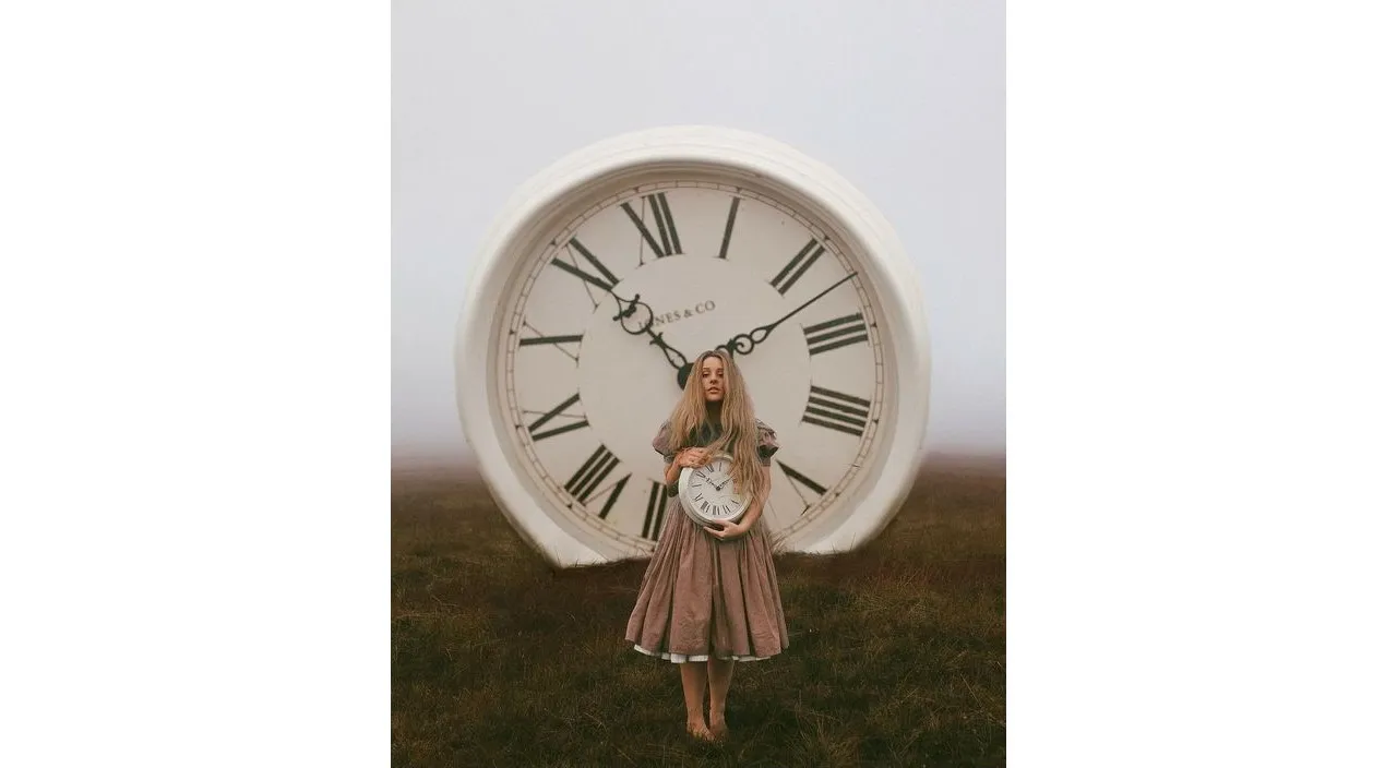 a woman standing in front of a large clock