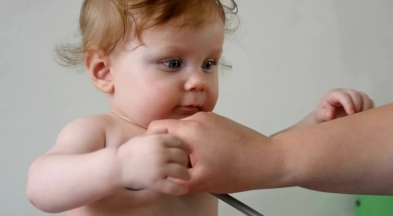 a baby being examined by a doctor with a stethoscope, create 3d animation video disney pixar style