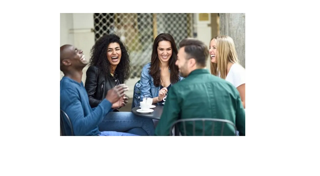 a group of people sitting around a table talking