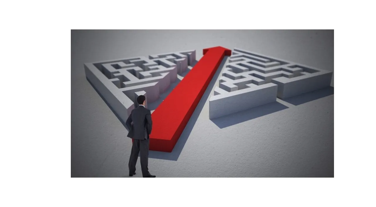 a man standing in front of a maze with a red arrow