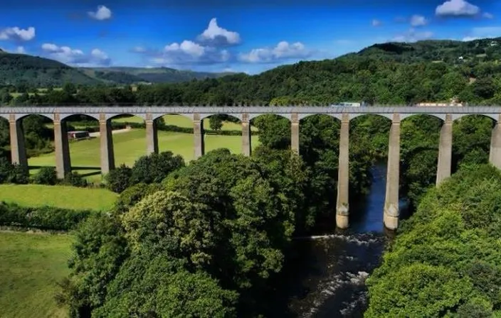 drone image flying under the arches of the bridge
, advertising style