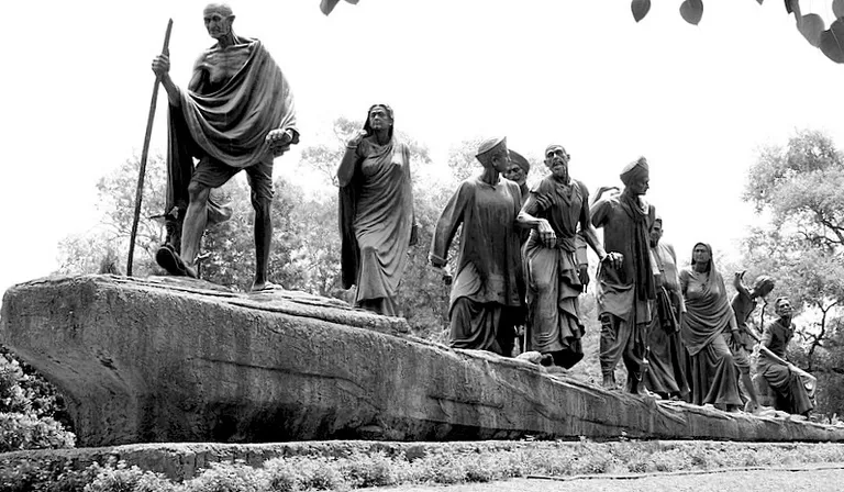 a black and white photo of a group of statues