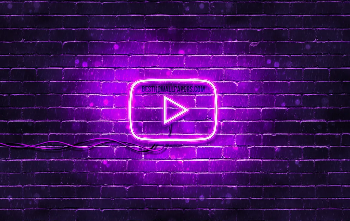 a purple neon sign on a brick wall