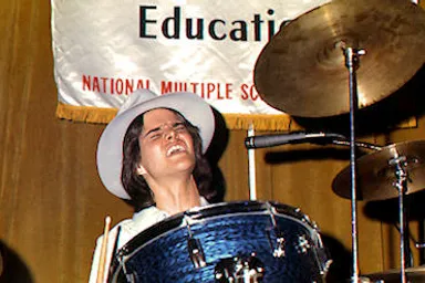 A Sperstar RocknRoll Drummer Singing and Playing the Drums