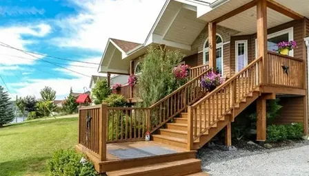 a house with a wooden porch and stairs