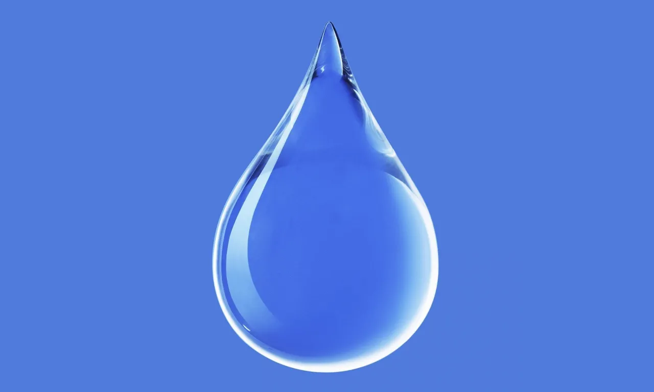 a drop of water on a blue background