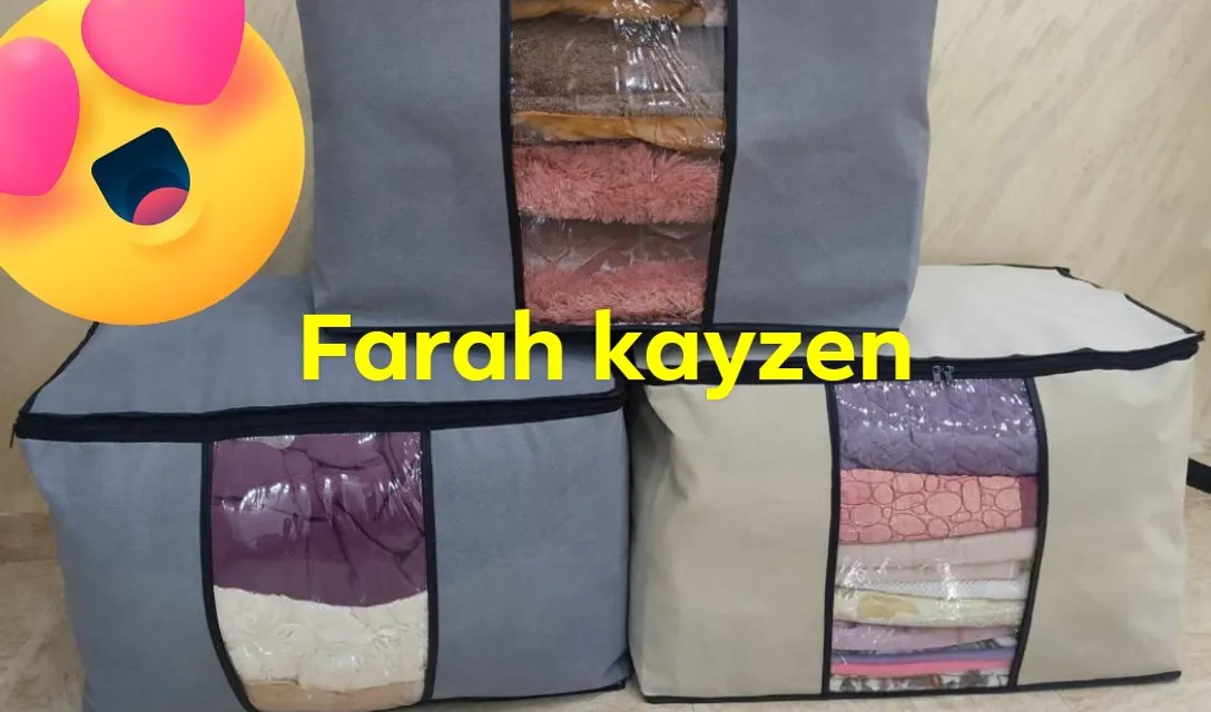 a set of four storage bags filled with clothes