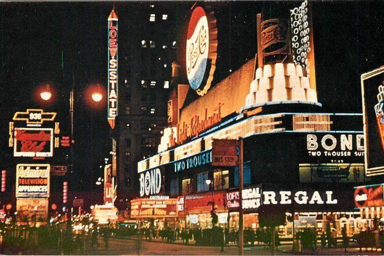 1950s New York Broadway city street filled with lots of tall buildings flashing lights 