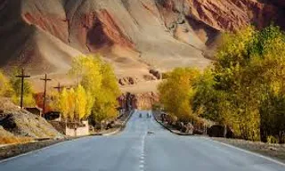 an empty road in the middle of the desert