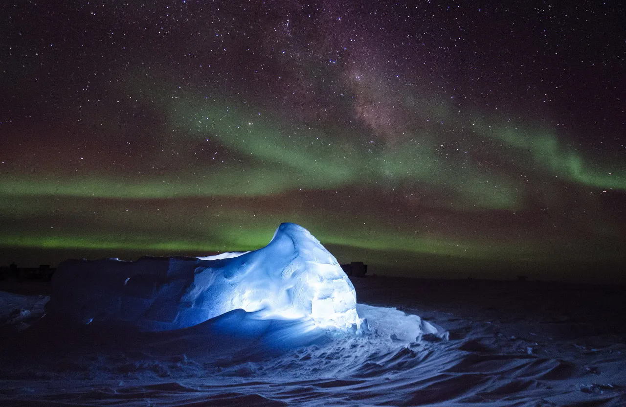 a large iceberg in the middle of the night