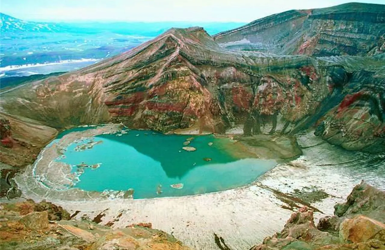 a mountain with a lake in the middle of it