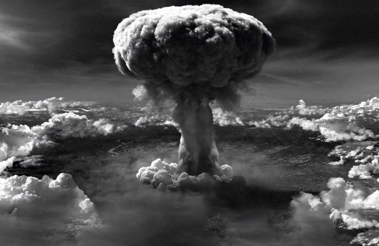 a black and white photo of a mushroom cloud