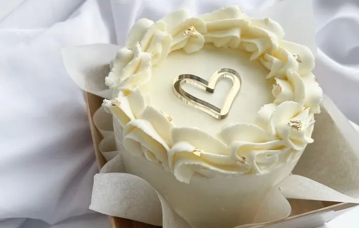 a cake in a box with a heart on it