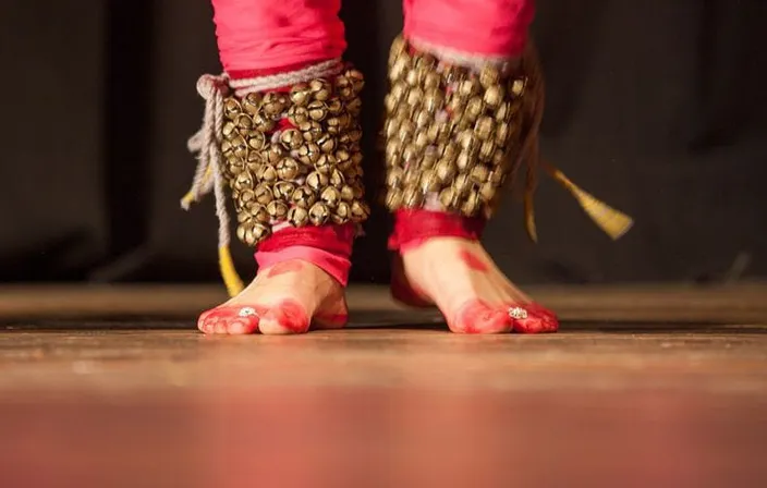 a close up of a person's feet wearing sandals