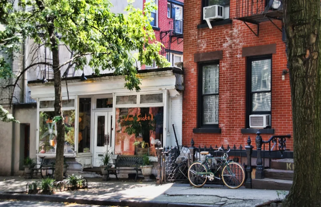 a couple of bikes parked in front of a building