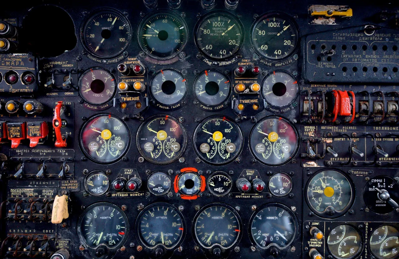 a close up of a plane cockpit with many gauges