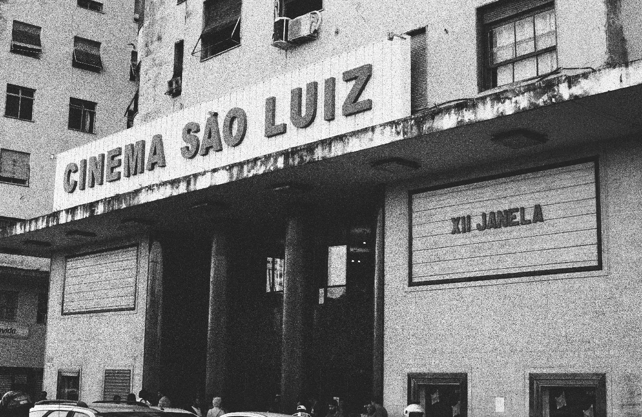 a black and white photo of a movie theater