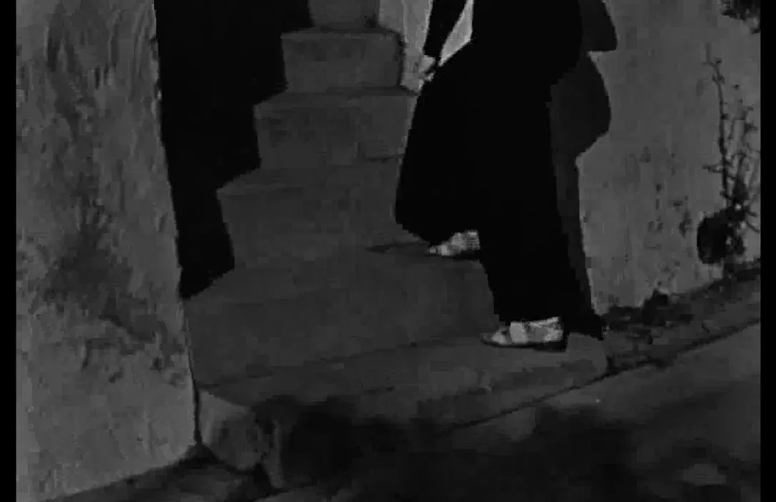 a woman walking down a flight of stairs