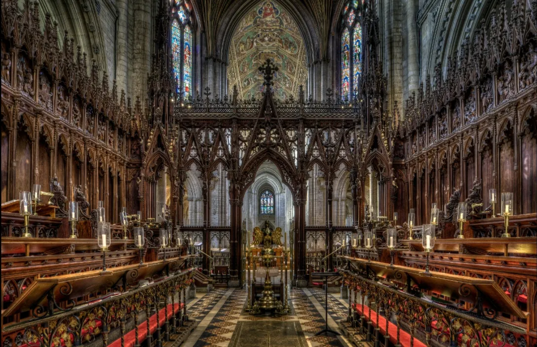 a large cathedral with stained glass windows and pews