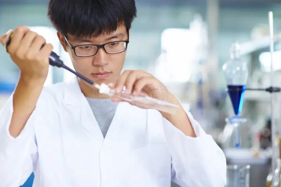 Japanese doctor with a test tube in his hands