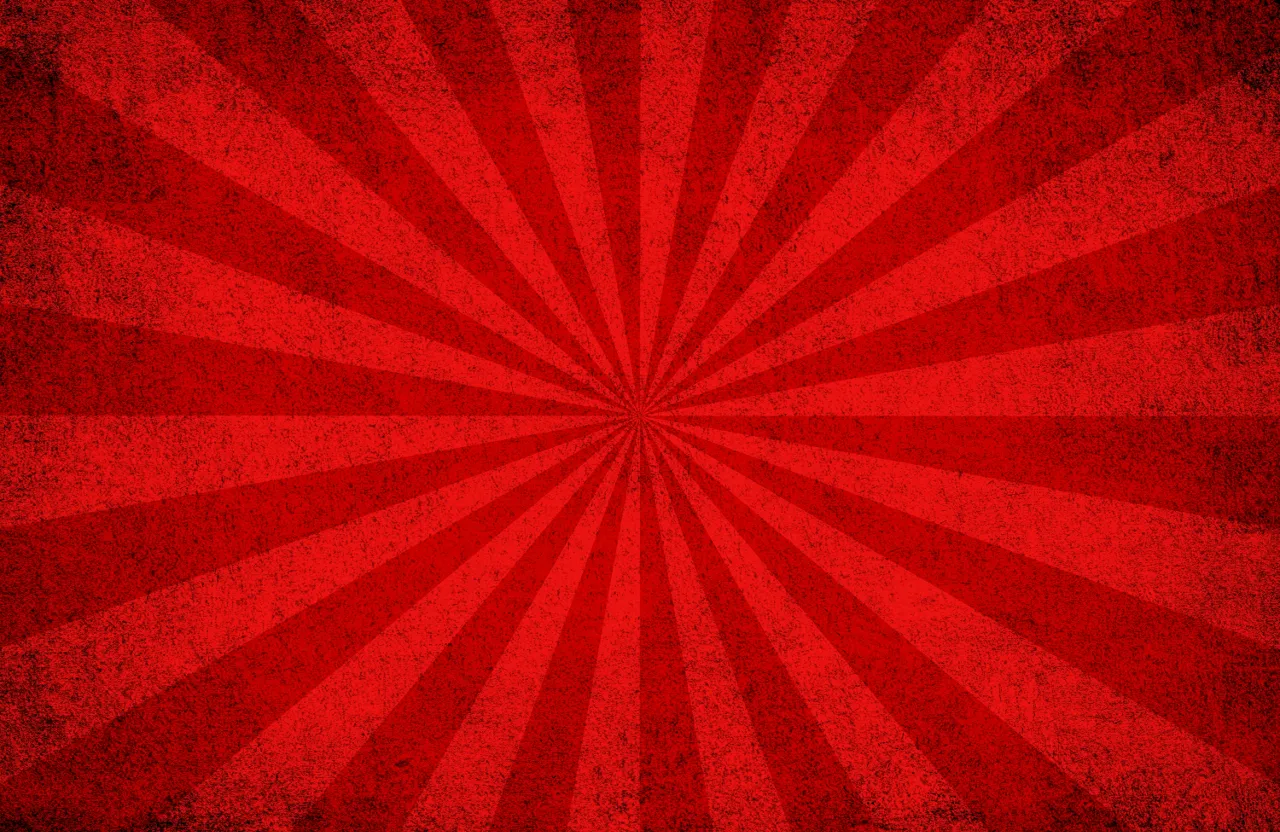 a red background with a sunburst pattern spining