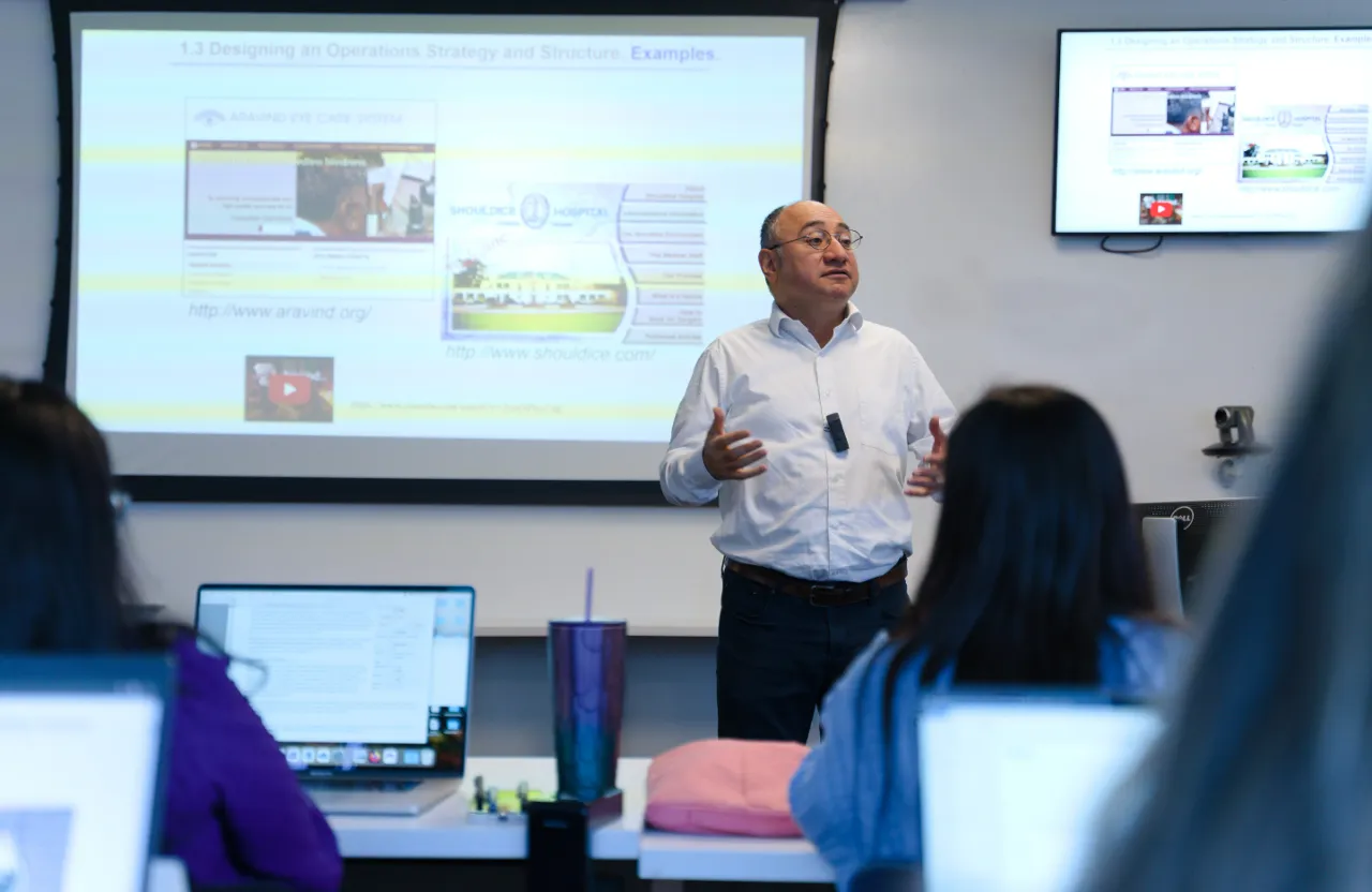 a man giving a presentation to a group of people