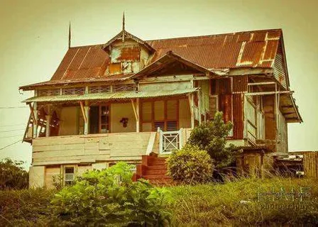 an old run down house with a rusted roof, golden hour, dolly away