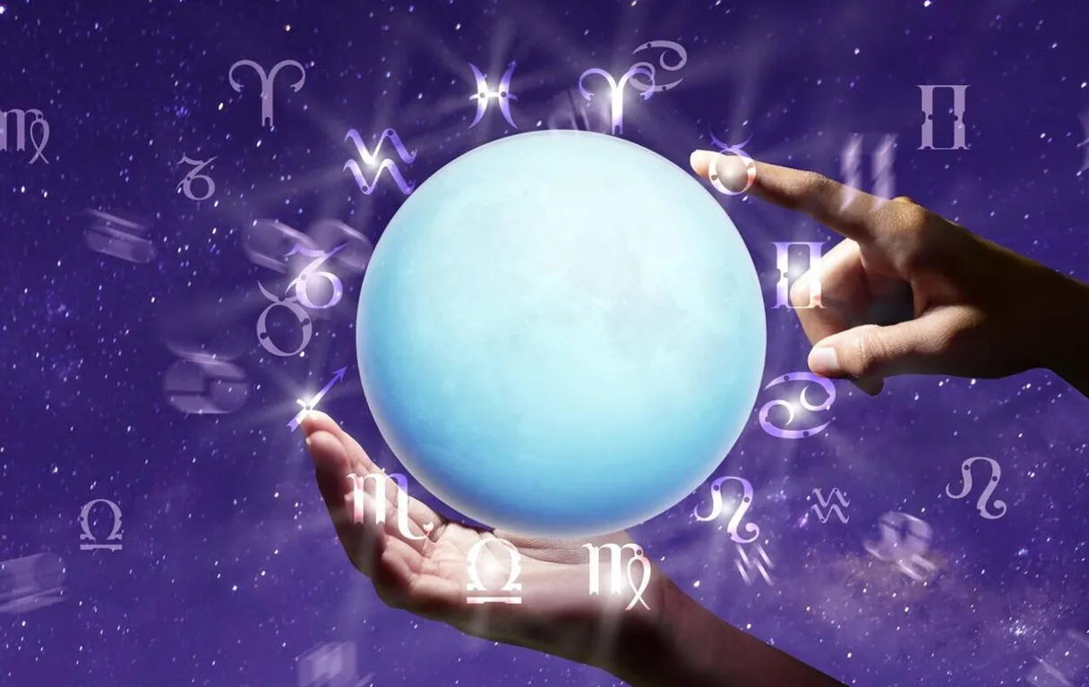 a person holding a blue ball in their hands