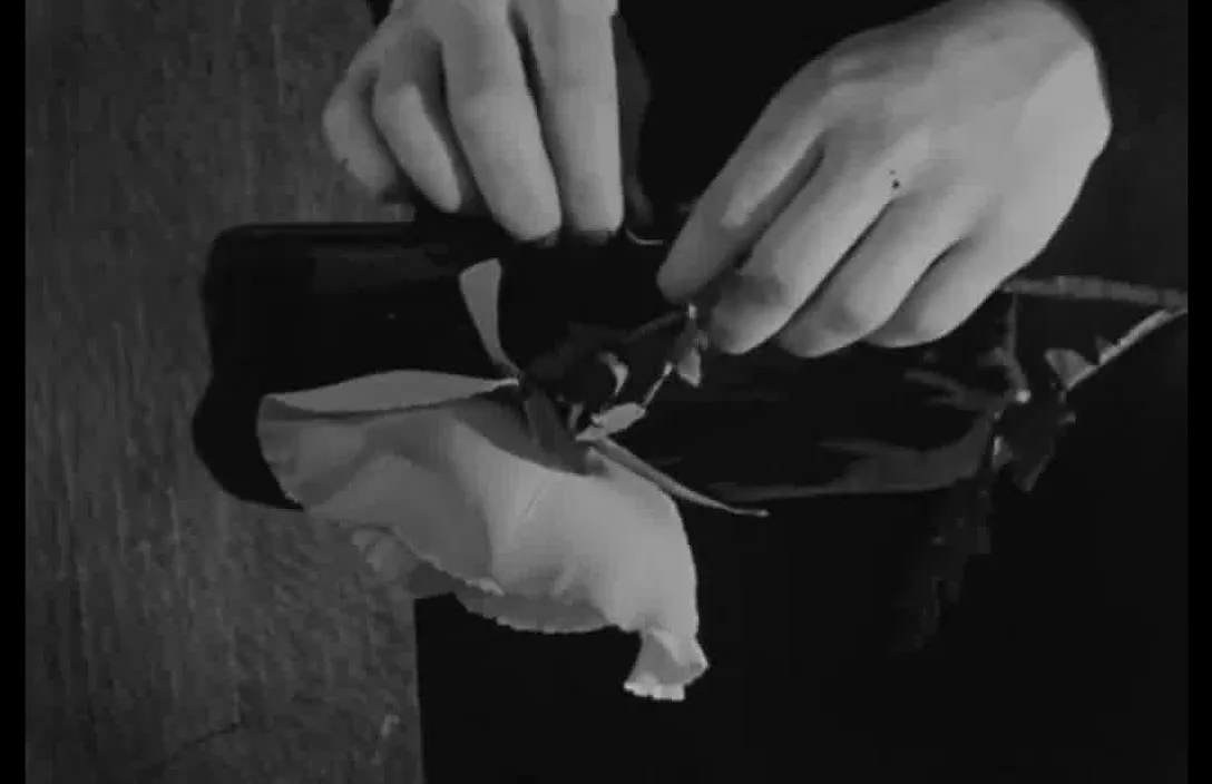 a black and white photo of a person opening a bag