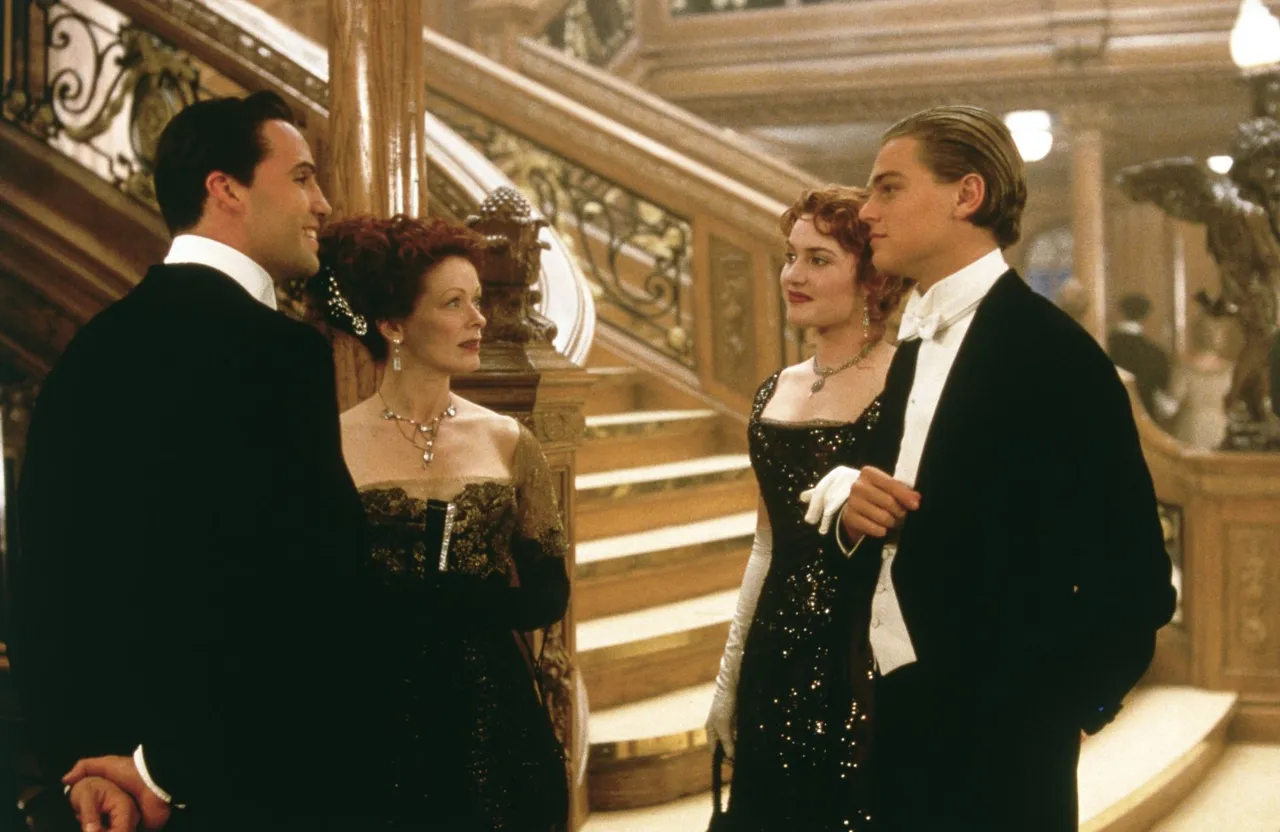 a man in a tuxedo standing next to two women