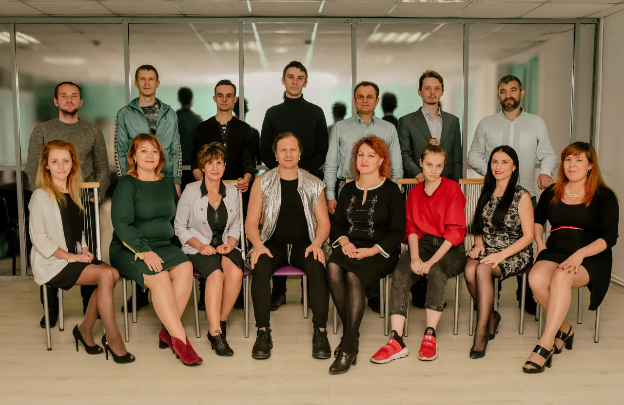 a group of people sitting next to each other