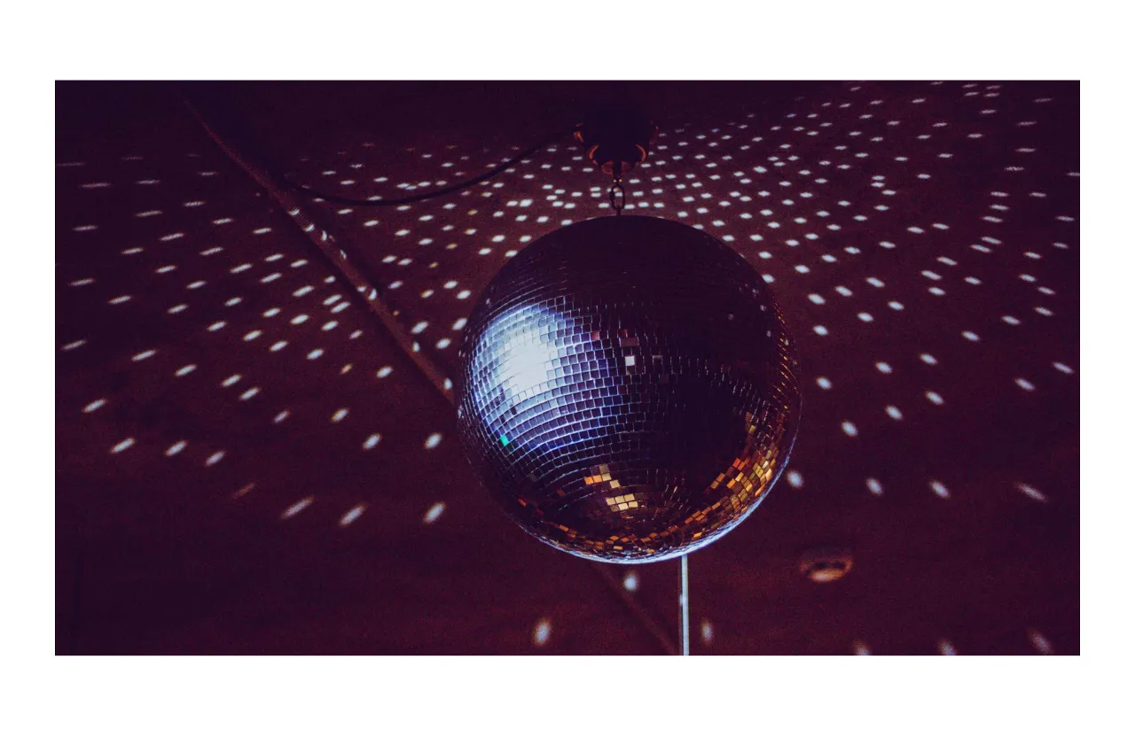 a disco ball sitting on top of a metal pole