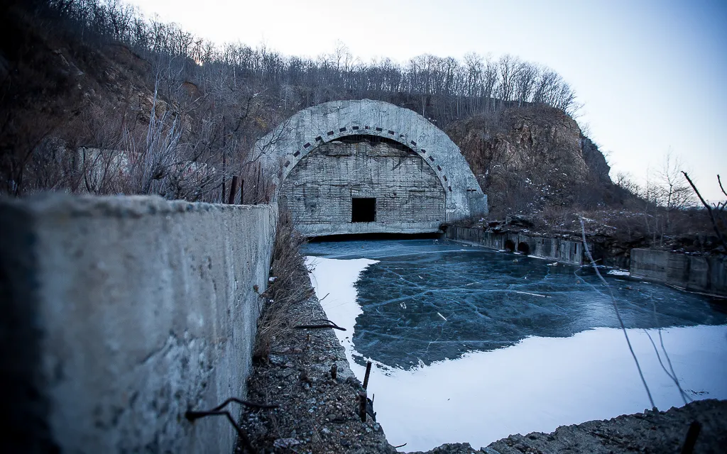 a concrete bridge over a body of water