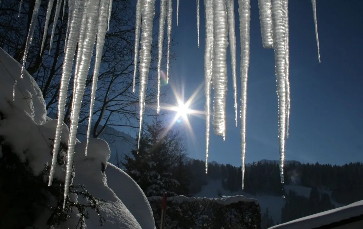 icicles hanging from the roof of a house