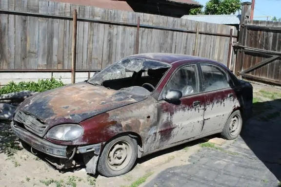 a car that is sitting in the dirt