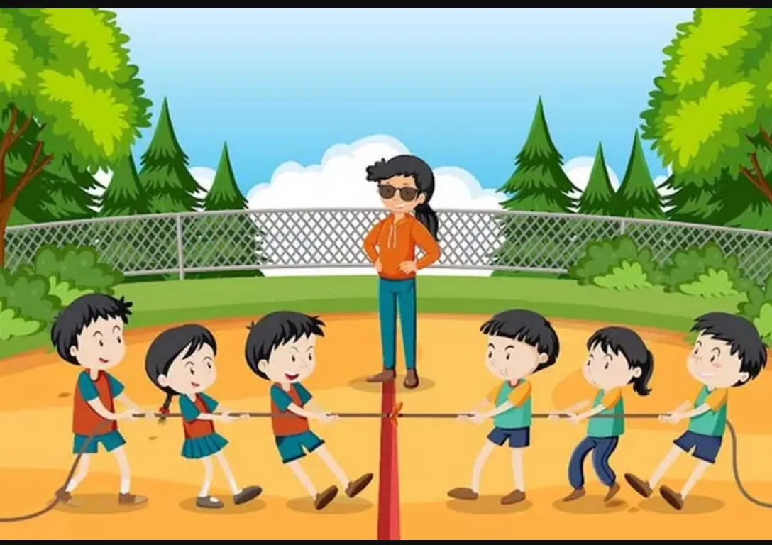 a group of children playing tug of war in the park