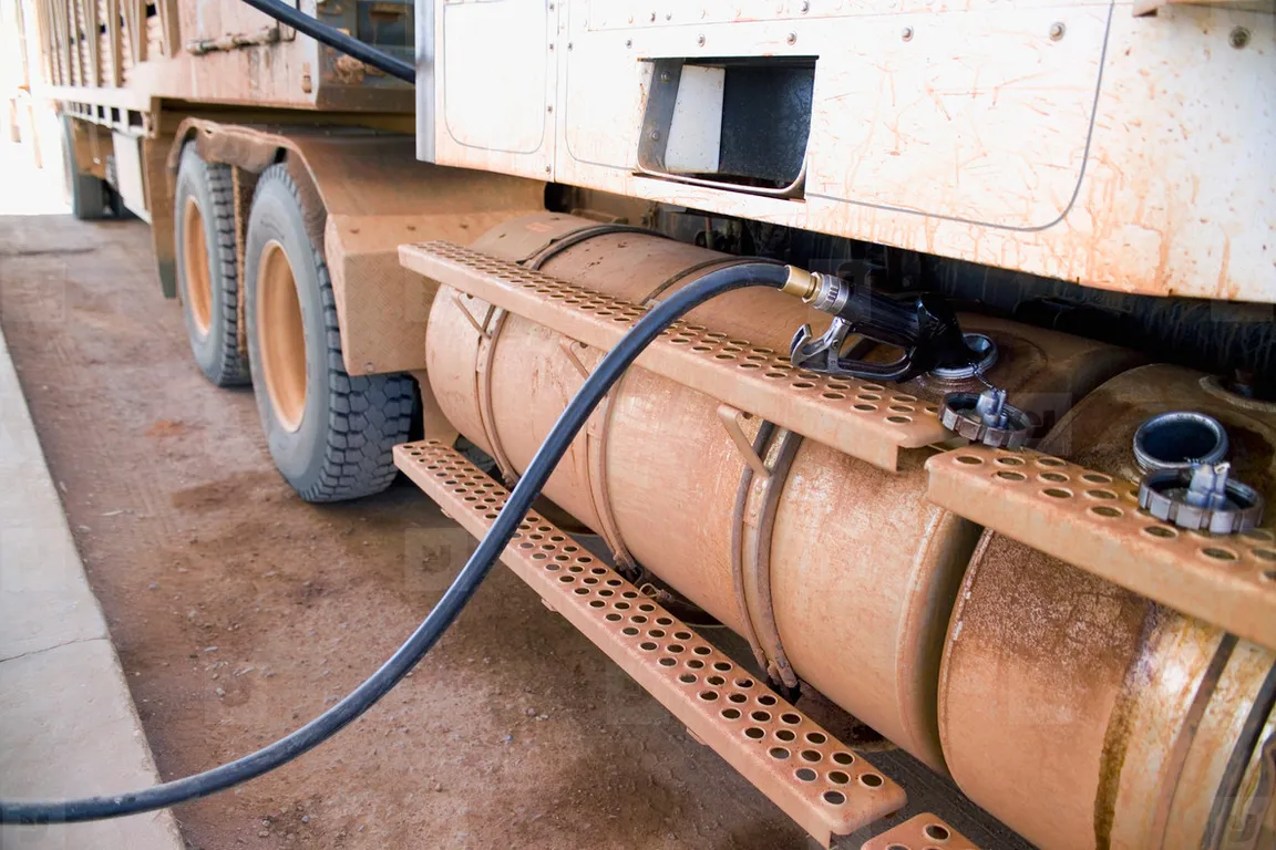 a close up of a truck with a hose connected to it